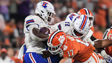 Sep 17, 2022; Clemson, South Carolina, USA; Clemson Tigers linebacker Wade Woodaz (17) tackles Louisiana Tech Bulldogs running back Charvis Thornton (22) during the third quarter at Memorial Stadium. Mandatory Credit: Ken Ruinard-USA TODAY Sports