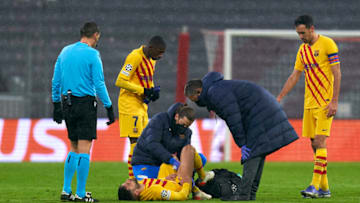 Barcelona's Jordi Alba lies injured on the pitch during the Champions League match against FC Bayern München at Football Arena Munich on December 08, 2021 in Munich, Germany. (Photo by Pedro Salado/Quality Sport Images/Getty Images)