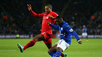 LEICESTER, ENGLAND - DECEMBER 02: Jeffrey Schlupp of Leicester City crosses the ball under pressure from Glen Johnson of Liverpool during the Barclays Premier League match between Leicester City and Liverpool at The King Power Stadium on December 2, 2014 in Leicester, England. (Photo by Clive Mason/Getty Images)
