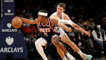 Dec 18, 2021; Brooklyn, New York, USA; Brooklyn Nets guard David Duke Jr. (6) steals the ball from Orlando Magic forward Franz Wagner (22) during the fourth quarter at Barclays Center. Mandatory Credit: Brad Penner-USA TODAY Sports