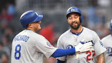 ATLANTA, GA - JULY 27: Matt Kemp #27 of the Los Angeles Dodgers is congratulated by Manny Machado #8 after scoring a fourth inning run against the Atlanta Braves at SunTrust Park on July 27, 2018 in Atlanta, Georgia. (Photo by Scott Cunningham/Getty Images)