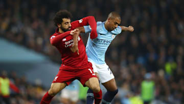 MANCHESTER, ENGLAND - JANUARY 03: Mohamed Salah of Liverpool battles for possession with Fernandinho of Manchester City during the Premier League match between Manchester City and Liverpool FC at the Etihad Stadium on January 3, 2019 in Manchester, United Kingdom. (Photo by Clive Brunskill/Getty Images)