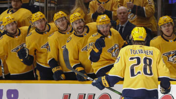 NASHVILLE, TENNESSEE - DECEMBER 04: Eeli Tolvanen #28 of the Nashville Predators is congratulated by teammates after scoring a goal against the Montreal Canadiens during the first period at Bridgestone Arena on December 04, 2021 in Nashville, Tennessee. (Photo by Frederick Breedon/Getty Images)