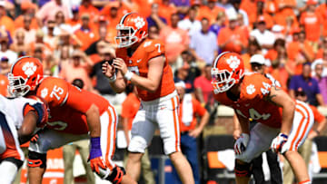 CLEMSON, SC - SEPTEMBER 29: Quarterback Chase Brice #7 prepares for the snap as offensive tackle Mitch Hyatt #75 and tight end Garrett Williams #44 of the Clemson Tigers line up against the Syracuse Orange during the football game at Clemson Memorial Stadium on September 29, 2018 in Clemson, South Carolina. (Photo by Mike Comer/Getty Images)