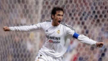 MADRID, SPAIN: Real Madrid's Raul Gonzalez (R) celebrates after scoring his first goal during their Spanish King's Cup cuarter final first leg match at Santiago Bernabeu stadium in Madrid. 21 January, 2004. AFP PHOTO Javier SORIANO. (Photo credit should read JAVIER SORIANO/AFP via Getty Images)