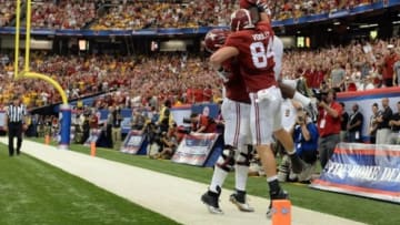 Aug 30, 2014; Atlanta, GA, USA; Alabama Crimson Tide running back T.J. Yeldon (4) celebrates his touchdown with offensive linesman Cam Robinson (74) and tight end Brian Vogler (84) during the second quarter of the 2014 Chick-fil-a kickoff game against the West Virginia Mountaineers at Georgia Dome. Mandatory Credit: John David Mercer-USA TODAY Sports