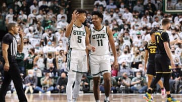 EAST LANSING, MI - JANUARY 29: A.J. Hoggard #11 and Max Christie #5 of the Michigan State Spartans celebrates in the second half of the game against the Michigan Wolverines at Breslin Center on January 29, 2022 in East Lansing, Michigan. (Photo by Rey Del Rio/Getty Images)