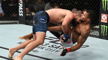 MONCTON, NB - OCTOBER 27: (L-R) Court McGee takes down Alex Garcia of Dominican Republic in their welterweight bout during the UFC Fight Night event inside Avenir Centre on October 27, 2018 in Moncton, New Brunswick, Canada. (Photo by Jeff Bottari/Zuffa LLC/Zuffa LLC via Getty Images)