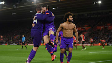 SOUTHAMPTON, ENGLAND - APRIL 05: Mohamed Salah of Liverpool celebrates with team mates Andy Robertson of Liverpool and Jordan Henderson of Liverpool after scoring their team's second goal during the Premier League match between Southampton FC and Liverpool FC at St Mary's Stadium on April 05, 2019 in Southampton, United Kingdom. (Photo by Mike Hewitt/Getty Images)