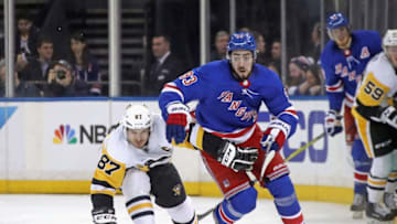 Sidney Crosby #87 of the Pittsburgh Penguins holds back Mika Zibanejad #93 of the New York Rangers (Photo by Bruce Bennett/Getty Images)