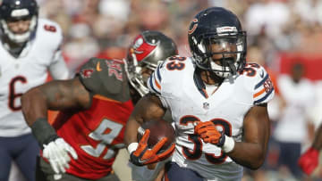 Dec 27, 2015; Tampa, FL, USA; Tampa Bay Buccaneers defensive end William Gholston (92) chases Chicago Bears running back Jeremy Langford (33) during the second half of a football game at Raymond James Stadium. The Bears won 26-12. Mandatory Credit: Reinhold Matay-USA TODAY Sports