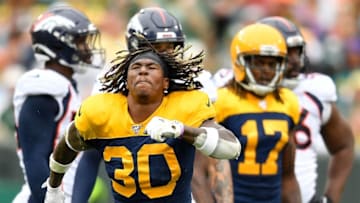 GREEN BAY, WISCONSIN - SEPTEMBER 22: Jamaal Williams #30 of the Green Bay Packers reacts after his first down in the second quarter against the Denver Broncos at Lambeau Field on September 22, 2019 in Green Bay, Wisconsin. (Photo by Quinn Harris/Getty Images)