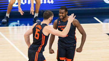 Dec 2, 2020; Indianapolis, Indiana, USA; Illinois Fighting Illini forward Giorgi Bezhanishvili (15) and Illinois Fighting Illini guard Da'Monte Williams (20) celebrate a three point basket in the first half against the Baylor Bears at Bankers Life Fieldhouse. Mandatory Credit: Trevor Ruszkowski-USA TODAY Sports