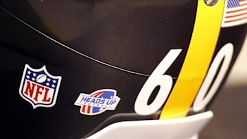 Aug 24, 2013; Pittsburgh, PA, USA; Pittsburgh Steelers helmet with the Heads Up Football logo on the sidelines against the Kansas City Chiefs during the fourth quarter at Heinz Field. The Kansas City Chiefs won 26-20 in overtime. Mandatory Credit: Charles LeClaire-USA TODAY Sports