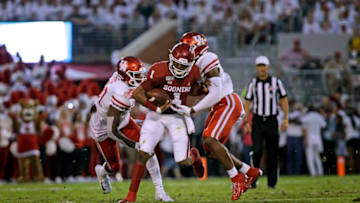 NORMAN, OK - SEPTEMBER 1: Quarterback Jalen Hurts #1 of the Oklahoma Sooners shakes a tackle against the Houston Cougars at Gaylord Family Oklahoma Memorial Stadium on September 1, 2019 in Norman, Oklahoma. The Sooners defeated the Cougars 49-31. (Photo by Brett Deering/Getty Images)
