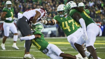 Auburn footballNov 13, 2021; Eugene, Oregon, USA; Oregon Ducks cornerback DJ James (0) tackles Washington State Cougars wide receiver De'Zhaun Stribling (88) during the first half at Autzen Stadium. Mandatory Credit: Troy Wayrynen-USA TODAY Sports