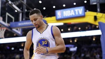 Jan 27, 2016; Oakland, CA, USA; Golden State Warriors guard Stephen Curry (30) holds stands on the floor before inbounding the ball against the Dallas Mavericks in the fourth quarter at Oracle Arena. The Warriors defeated the Mavericks 127-107. Mandatory Credit: Cary Edmondson-USA TODAY Sports