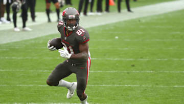 Jan 3, 2021; Tampa, Florida, USA; Tampa Bay Buccaneers wide receiver Antonio Brown (81) runs the ball in for a touchdown against the Atlanta Falcons during the second half at Raymond James Stadium. Mandatory Credit: Kim Klement-USA TODAY Sports