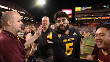TEMPE, AZ - OCTOBER 14: Quarterback Manny Wilkins #5 of the Arizona State Sun Devils is congratulted by fans after defeating the Washington Huskies in the college football game at Sun Devil Stadium on October 14, 2017 in Tempe, Arizona. The Sun Devils defeated the Huskies 13-7. (Photo by Christian Petersen/Getty Images)
