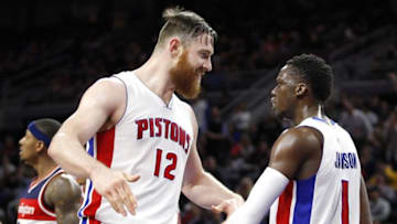 Apr 8, 2016; Auburn Hills, MI, USA; Detroit Pistons guard Reggie Jackson (1) celebrates with center Aron Baynes (12) during the fourth quarter against the Washington Wizards at The Palace of Auburn Hills. Pistons win 112-99. Mandatory Credit: Raj Mehta-USA TODAY Sports
