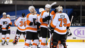 Mar 15, 2021; New York, New York, USA; The Flyers celebrate their 5-4 overtime victory over the New York Rangers at Madison Square Garden on March 15, 2021 in New York City. Mandatory Credit: Bruce Bennett/POOL PHOTOS-USA TODAY Sports