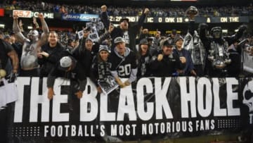 November 20, 2014; Oakland, CA, USA; Oakland Raiders fans celebrate during the second quarter against the Kansas City Chiefs at O.co Coliseum. Mandatory Credit: Kyle Terada-USA TODAY Sports