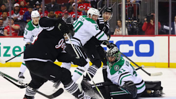 Dec 13, 2022; Newark, New Jersey, USA; New Jersey Devils left wing Miles Wood (44) looks for the puck after a save by Dallas Stars goaltender Scott Wedgewood (41) during the second period at Prudential Center. Mandatory Credit: Ed Mulholland-USA TODAY Sports