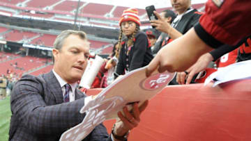 SANTA CLARA, CA - DECEMBER 24: General Manager John Lynch signs autographs for fans prior to their NFL game against the Jacksonville Jaguars at Levi's Stadium on December 24, 2017 in Santa Clara, California. (Photo by Robert Reiners/Getty Images)
