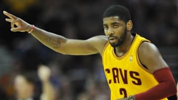 Apr 5, 2014; Cleveland, OH, USA; Cleveland Cavaliers guard Kyrie Irving (2) celebrates a three-point basket in the first quarter against the Charlotte Bobcats at Quicken Loans Arena. Mandatory Credit: David Richard-USA TODAY Sports