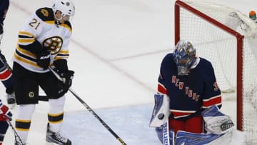 Mar 23, 2016; New York, NY, USA; New York Rangers goalie Henrik Lundqvist (30) stops a shot by Boston Bruins left wing Loui Eriksson (21) in front of the goal during second period at Madison Square Garden. Mandatory Credit: Noah K. Murray-USA TODAY Sports