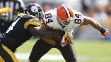 Sep 7, 2014; Pittsburgh, PA, USA; Cleveland Browns tight end Jordan Cameron (84) is tackled after a pass reception by Pittsburgh Steelers inside linebacker Lawrence Timmons (94) during the first quarter at Heinz Field. Mandatory Credit: Charles LeClaire-USA TODAY Sports