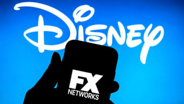 SPAIN - 2022/02/17: In this photo illustration a FX Networks logo seen displayed on a smartphone with a The Walt Disney Company logo in the background. (Photo Illustration by Thiago Prudencio/SOPA Images/LightRocket via Getty Images)