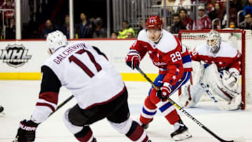 WASHINGTON, DC - NOVEMBER 11: Washington Capitals defenseman Christian Djoos (29) sends the puck past Arizona Coyotes center Alex Galchenyuk (17) during a NHL game between the Washington Capitals and the Arizona Coyotes on November 11, 2018, at Capital One Arena, in Washington, D.C.The Coyotes defeated the Capitals 4-1.(Photo by Tony Quinn/Icon Sportswire via Getty Images)