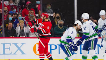 Jan 15, 2022; Raleigh, North Carolina, USA; Carolina Hurricanes center Vincent Trocheck (16) celebrates his goal against the Vancouver Canucks during the second period at PNC Arena. Mandatory Credit: James Guillory-USA TODAY Sports