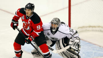 NEWARK, NJ - MAY 30: Zach Parise #9 of the New Jersey Devils fights for position with Jonathan Quick #32 of the Los Angeles Kings during Game One of the 2012 NHL Stanley Cup Final at the Prudential Center on May 30, 2012 in Newark, New Jersey. (Photo by Paul Bereswill/Getty Images)