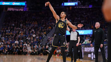 Apr 16, 2022; San Francisco, California, USA; Golden State Warriors guard Jordan Poole (3) follows through on a shot after making a three point basket against the Denver Nuggets in the fourth quarter during game one of the first round for the 2022 NBA playoffs at the Chase Center. Mandatory Credit: Cary Edmondson-USA TODAY Sports