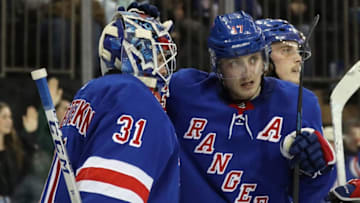 NEW YORK, NEW YORK - FEBRUARY 22: Igor Shesterkin #31 and Jesper Fast #17 of the New York Rangers celebrate their 3-2 victory over the San Jose Sharks at Madison Square Garden on February 22, 2020 in New York City. (Photo by Bruce Bennett/Getty Images)