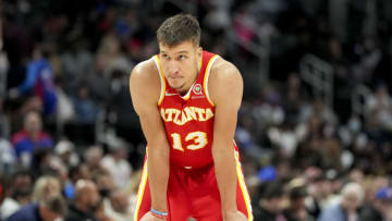 DETROIT, MICHIGAN - MARCH 23: Bogdan Bogdanovic #13 of the Atlanta Hawks looks on against the Detroit Pistons during the third quarter at Little Caesars Arena on March 23, 2022 in Detroit, Michigan. NOTE TO USER: User expressly acknowledges and agrees that, by downloading and or using this photograph, User is consenting to the terms and conditions of the Getty Images License Agreement. (Photo by Nic Antaya/Getty Images)