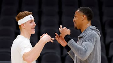 ATLANTA, GA - NOVEMBER 23: Kevin Huerter #9 of the Sacramento Kings speaks with John Collins #20 of the Atlanta Hawks prior to the game at State Farm Arena on November 23, 2022 in Atlanta, Georgia. NOTE TO USER: User expressly acknowledges and agrees that, by downloading and or using this photograph, User is consenting to the terms and conditions of the Getty Images License Agreement. (Photo by Todd Kirkland/Getty Images)