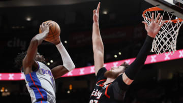 Jerami Grant #9 of the Detroit Pistons shoots against Jusuf Nurkic #27 of the Portland Trail Blazers (Photo by Steph Chambers/Getty Images)