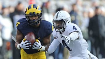 ANN ARBOR, MI - NOVEMBER 03: Nico Collins #4 of the Michigan Wolverines makes the second quarter catch as Nick Scott #4 of the Penn State Nittany Lions defends at Michigan Stadium on November 3, 2018 in Ann Arbor, Michigan. (Photo by Leon Halip/Getty Images)