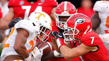 ATHENS, GEORGIA - OCTOBER 10: Jaylen McCollough #22 of the Tennessee Volunteers strips the ball from Jermaine Burton #7 of the Georgia Bulldogs during the second half at Sanford Stadium on October 10, 2020 in Athens, Georgia. (Photo by Kevin C. Cox/Getty Images)