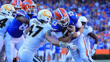 GAINESVILLE, FL - NOVEMBER 03: Feleipe Franks #13 of the Florida Gators rushes for yardage during the game against the Missouri Tigers at Ben Hill Griffin Stadium on November 3, 2018 in Gainesville, Florida. (Photo by Sam Greenwood/Getty Images)