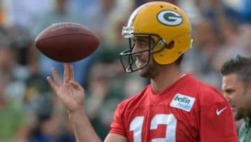 Jul 26, 2013; Green Bay, WI, USA; Green Bay Packers quarterback Aaron Rodgers works out during opening day of training camp at Nitschke Field. Mandatory Credit: Benny Sieu-USA TODAY Sports