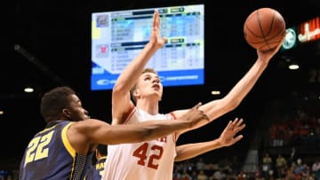 March 11, 2016; Las Vegas, NV, USA; Utah Utes forward Jakob Poeltl (42) shoots the basketball against California Golden Bears center Kingsley Okoroh (22) during the first half in the semifinals of the Pac-12 Conference tournament at MGM Grand Garden Arena. Mandatory Credit: Kyle Terada-USA TODAY Sports