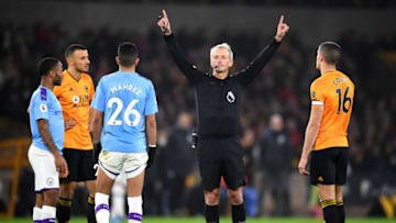 WOLVERHAMPTON, ENGLAND - DECEMBER 27: Referee Martin Atkinson awards a penalty to Wolves following a VAR check during the Premier League match between Wolverhampton Wanderers and Manchester City at Molineux on December 27, 2019 in Wolverhampton, United Kingdom. (Photo by Clive Mason/Getty Images)