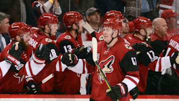 GLENDALE, AZ - MARCH 16: Lawson Crouse #67 of the Arizona Coyotes is congratulated by teammates after scoring a third period goal against the Detroit Red Wings at Gila River Arena on March 16, 2017 in Glendale, Arizona. (Photo by Norm Hall/NHLI via Getty Images)