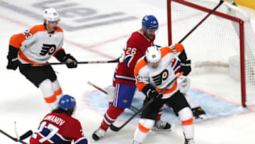 Dec 16, 2021; Montreal, Quebec, CAN; Philadelphia Flyers right wing Cam Atkinson (89) plays the puck in front of Montreal Canadiens goaltender Cayden Primeau (30) and defenseman Jeff Petry (26) during the third period at Bell Centre. Mandatory Credit: Jean-Yves Ahern-USA TODAY Sports