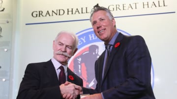 Chairman of the Hockey Hall of Fame Lanny McDonald presents Dave Andreychuk with the Hall ring during a media opportunity at the Hockey Hall Of Fame and Museum on November 10, 2017 in Toronto, Canada. (Photo by Bruce Bennett/Getty Images)