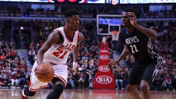 Feb 27, 2015; Chicago, IL, USA; Chicago Bulls guard Jimmy Butler (21) drives on Minnesota Timberwolves forward Andrew Wiggins (22) during the second half at the United Center. Chicago won 96-89. Mandatory Credit: Dennis Wierzbicki-USA TODAY Sports